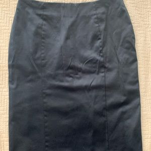 Dark blue pencil skirt with 2 back slits. Size 20. Barely worn.